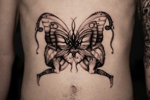 Butterfly in top belly under chest