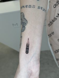Microrealism pencil tattoo on right inner forearm