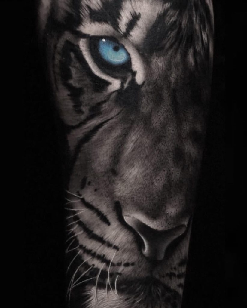 In bushwick realism tiger tattoo blue eyes black and white